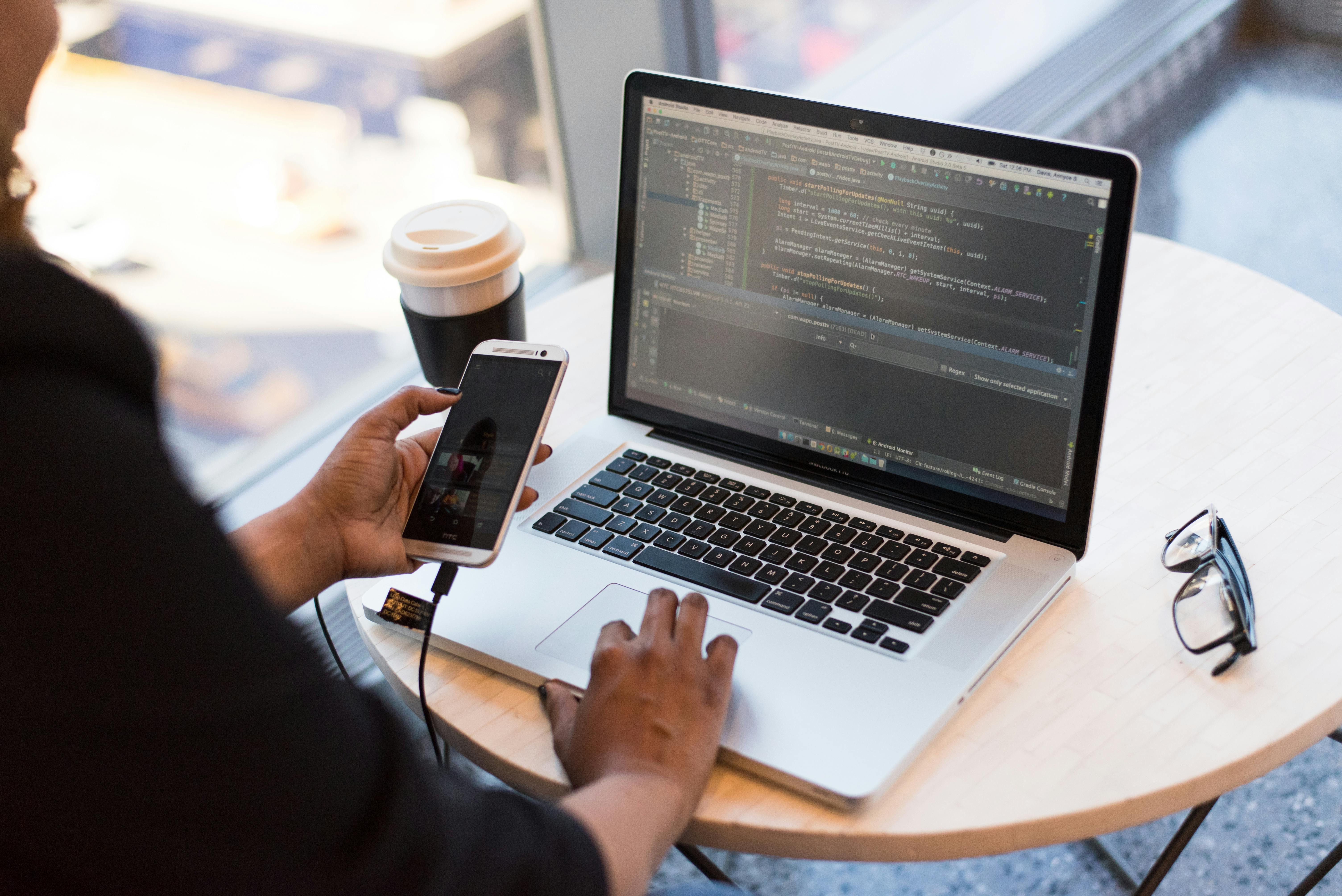 A person programming on a computer